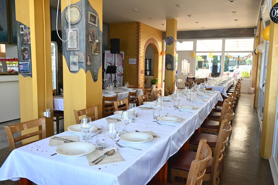 Terrace with flowers and sea view at Restaurant Jadranka